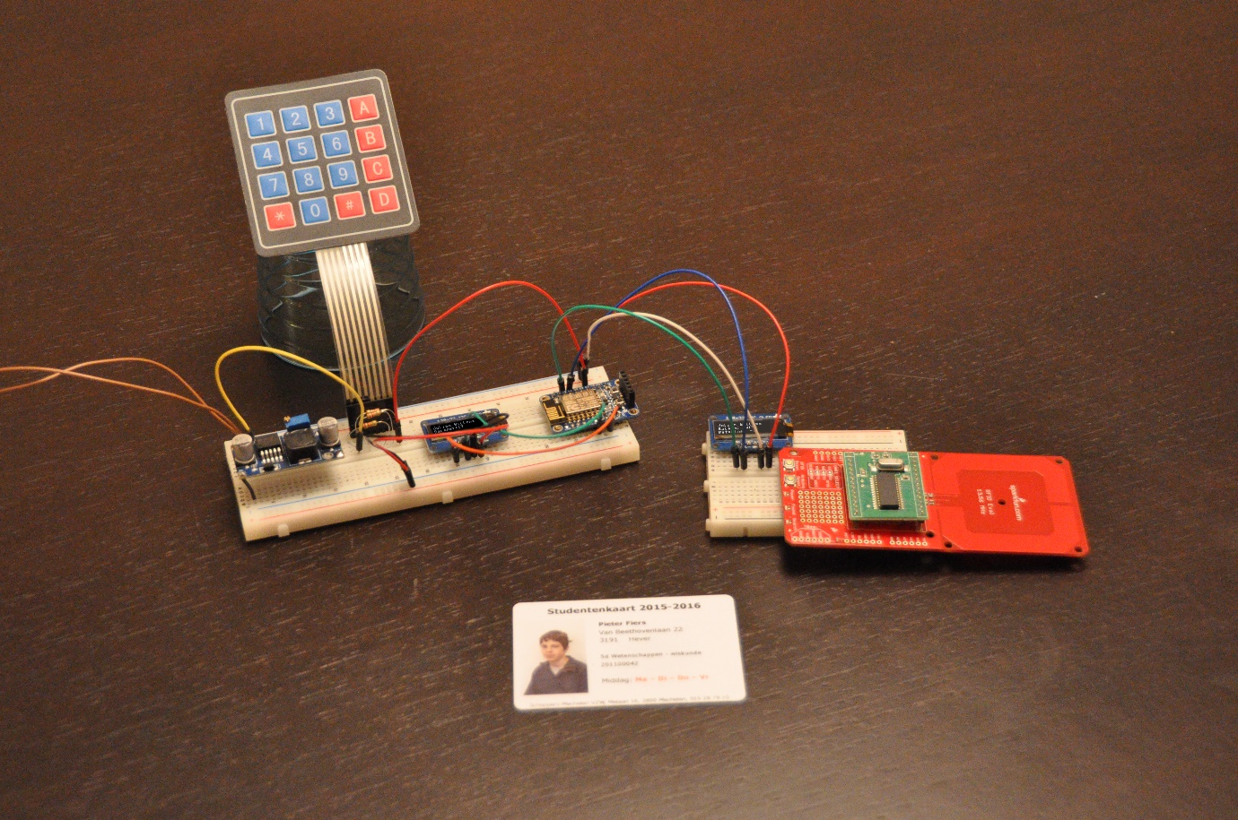 Picture of the hardware of the DSpay prototype on a table, showing a keypad,
microcontroller, small matrix display and an NFC reader