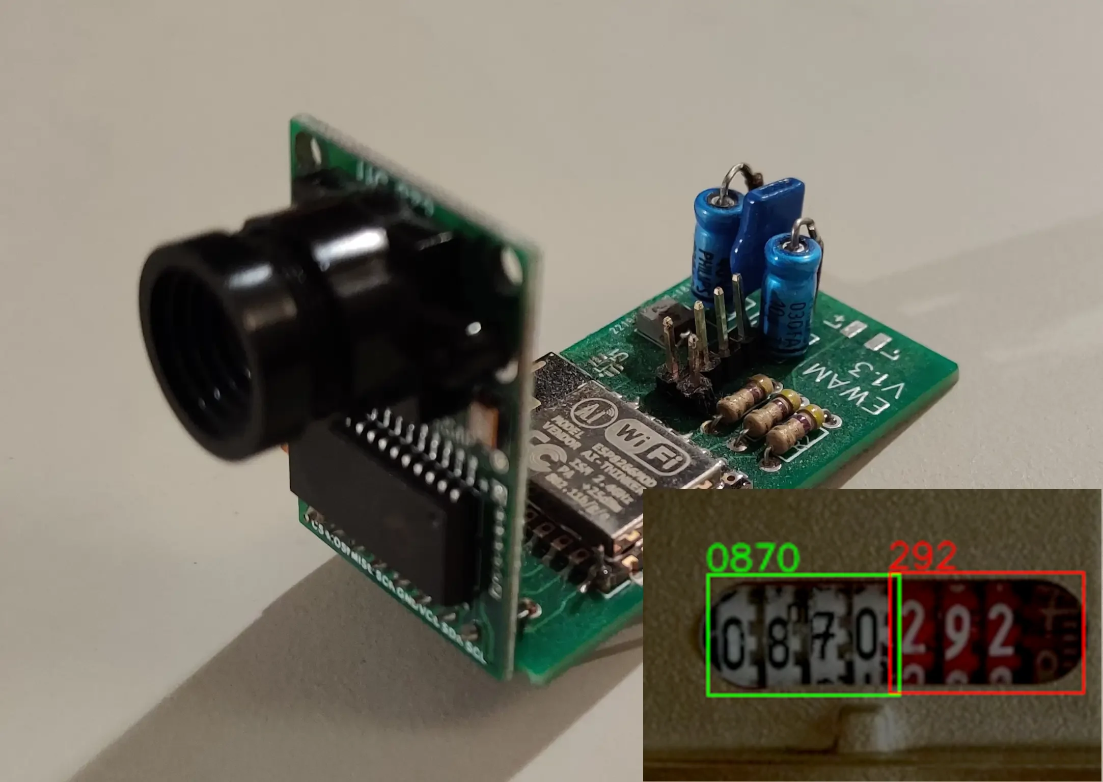 Picture of the Esp Water Meter PCB, showing circuitry and a small camera. The
bottom-right of image also shows digits being recognized by the neural
net.