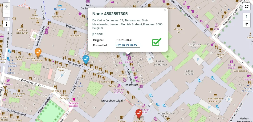 Screenshot of the OSM Contact Info Corrector webapp, showing businesses with a
  phone icon and an input form to correct the contact information of the
  selected one.